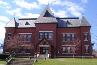 The Gothic Revival Municipal Center , built as Brattleboro's High School, served the town in that capacity until 1951