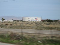 A water storage tank with the city of Hesperia logo and Welcome sign