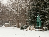 A snowy day in Carle Park west of the Urbana High School. On the right is a statue of Abraham Lincoln by Lorado Taft.