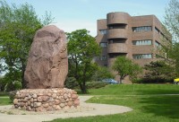 Lawrence City Hall with the Shunganunga Boulder in Robinson Park at the north end of Massachusetts Street