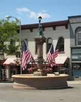 The Bear Fountain sits in the center of Geneseo village's main street. In this picture, it is decorated with flags for Memorial Day.
